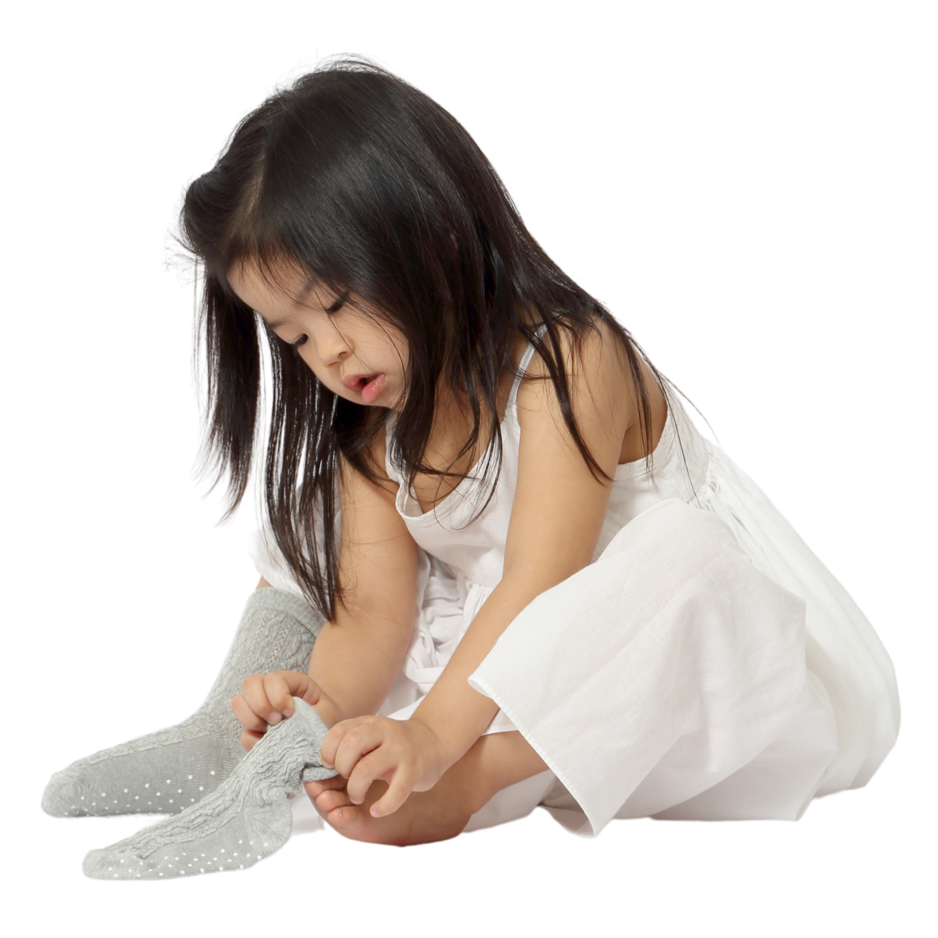 Young girl putting on a sock